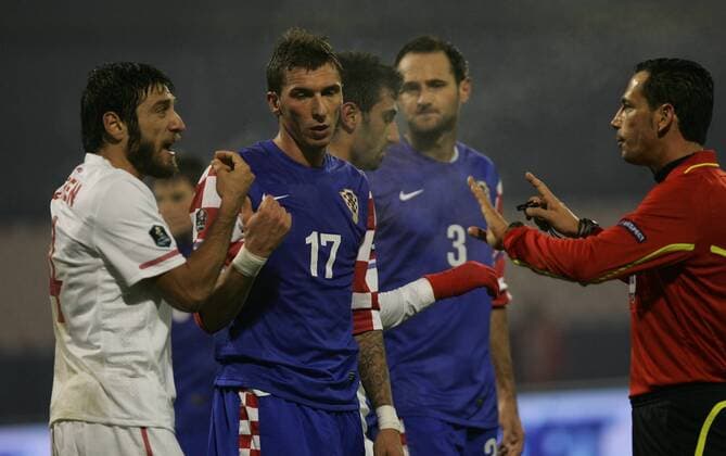 Zagreb, Croatia (blue) - Turkey (white), Mario Mandzukic (Croatia-17), Egemen Korkmaz (Turkey-4) and referee Pedro Proenca