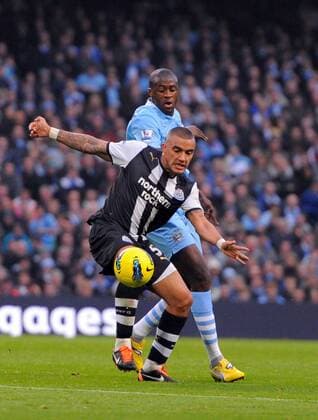 Danny Simpson of Newcastle United and Yaya Toure of Manchester City - Premier League Manchester City v Newcastle United 19th November, 2011 EDITORIAL USE ONLY. No use with unauthorised audio, video, data, fixture lists, club league logos or live services. Online in-match use limited to 120 images, no video emulation. No use in betting, games or single club league player publications.