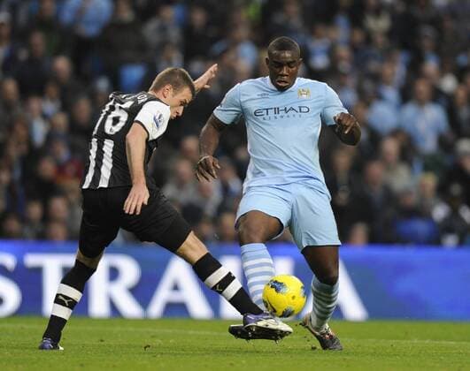 Micah Richards of Manchester City wins the ball off Ryan Taylor of Newcastle United to score the second goal - Premier League Manchester City v Newcastle United 19th November, 2011 EDITORIAL USE ONLY. No use with unauthorised audio, video, data, fixture lists, club league logos or live services. Online in-match use limited to 120 images, no video emulation. No use in betting, games or single club league player publications.
