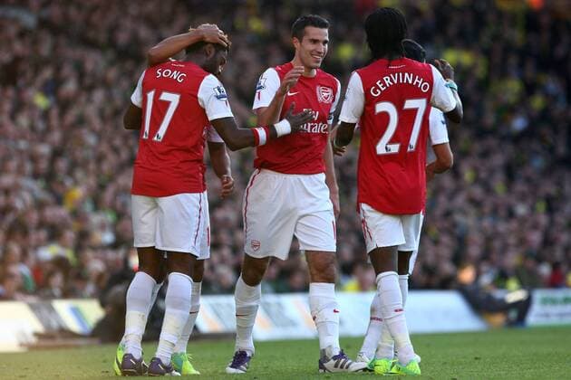 Football - Premier League - Norwich City vs. Arsenal FC at Carrow Road, Norwich - Robin Van Persie celebrates scoring the second goal for Arsenal with team mates.  3428-3428