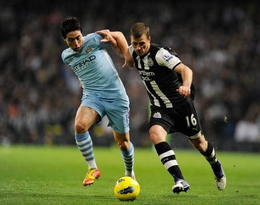 Samir Nasri of Manchester City and and Ryan Taylor of Newcastle United - Premier League Manchester City v Newcastle United 19th November, 2011 EDITORIAL USE ONLY. No use with unauthorised audio, video, data, fixture lists, club league logos or live services. Online in-match use limited to 120 images, no video emulation. No use in betting, games or single club league player publications.