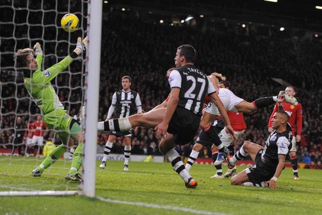 Tim Krul of Newcastle United makes a point blank save from a Nemanja Vidic of Manchester United header Barclays Premier League Manchester United v Newcastle United 26th November, 2011 EDITORIAL USE ONLY. No use with unauthorised audio, video, data, fixture lists, club league logos or live services. Online in-match use limited to 120 images, no video emulation. No use in betting, games or single club league player publications.