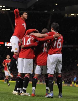 Javier Chicharito Hernandez of Manchester United celebrates his goal as Fabio Da Silva of Manchester United jumps up Barclays Premier League Manchester United v Newcastle United 26th November, 2011 EDITORIAL USE ONLY. No use with unauthorised audio, video, data, fixture lists, club league logos or live services. Online in-match use limited to 120 images, no video emulation. No use in betting, games or single club league player publications.