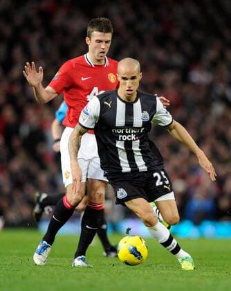 Gabriel Obertan of Newcastle United gets past Michael Carrick of Manchester United Barclays Premier League Manchester United v Newcastle United 26th November, 2011 EDITORIAL USE ONLY. No use with unauthorised audio, video, data, fixture lists, club league logos or live services. Online in-match use limited to 120 images, no video emulation. No use in betting, games or single club league player publications.