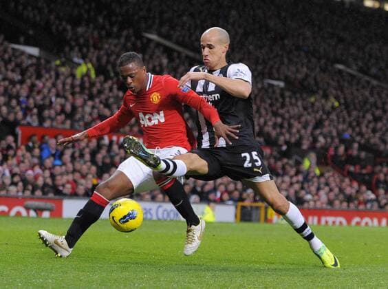Gabriel Obertan of Newcastle United tackles Patrice Evra of Manchester United Barclays Premier League Manchester United v Newcastle United 26th November, 2011 EDITORIAL USE ONLY. No use with unauthorised audio, video, data, fixture lists, club league logos or live services. Online in-match use limited to 120 images, no video emulation. No use in betting, games or single club league player publications.