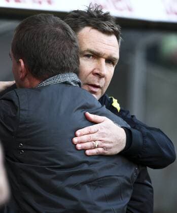 Football - Barclays Premier League - Swansea City vs. Aston Villa at Liberty Stadium, Swansea Aston Villa coach, Peter Grant, gives some consolation to Swansea City manager, Brendan Rodgers.  3452-3452
