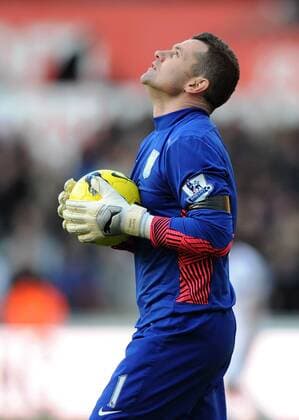 Football - Premier League - Swansea vs. Aston Villa Aston Villa s Shay Given looks to the sky at the final whistle on the day his ex-Newcastle team mate and manager of Wales Gary Speed was found dead at his home, at the Liberty Stadium, Swansea 