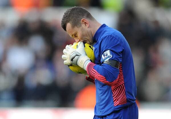 Football - Premier League - Swansea vs. Aston Villa Aston Villa s Shay Given kisses the football at the final whistle on the day his ex-Newcastle team mate and manager of Wales Gary Speed was found dead at home, at the Liberty Stadium, Swansea 
