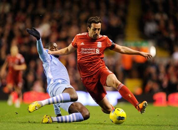Yaya Toure of Manchester City tackles Jose Enrique of Liverpool Barclays Premier League Liverpool v Manchester City 27th November, 2011 EDITORIAL USE ONLY. No use with unauthorised audio, video, data, fixture lists, club league logos or live services. Online in-match use limited to 120 images, no video emulation. No use in betting, games or single club league player publications.
