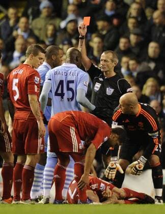 Mario Balotelli of Manchester City receives a red card of referee Martin Atkinson Barclays Premier League Liverpool v Manchester City 27th November, 2011 EDITORIAL USE ONLY. No use with unauthorised audio, video, data, fixture lists, club league logos or live services. Online in-match use limited to 120 images, no video emulation. No use in betting, games or single club league player publications.