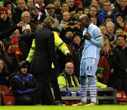 Roberto Mancini manager of Manchester City seems exasperated with Mario Balotelli of Manchester City following his red card Barclays Premier League Liverpool v Manchester City 27th November, 2011 EDITORIAL USE ONLY. No use with unauthorised audio, video, data, fixture lists, club league logos or live services. Online in-match use limited to 120 images, no video emulation. No use in betting, games or single club league player publications.