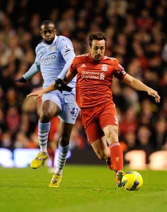 Yaya Toure of Manchester City tackles Jose Enrique of Liverpool Barclays Premier League Liverpool v Manchester City 27th November, 2011 EDITORIAL USE ONLY. No use with unauthorised audio, video, data, fixture lists, club league logos or live services. Online in-match use limited to 120 images, no video emulation. No use in betting, games or single club league player publications.