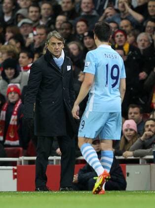 Manchester Citys Roberto Mancini with Samir Nasri Carling Cup quarter final Arsenal v Manchester City 29th November, 2011 EDITORIAL USE ONLY. No use with unauthorised audio, video, data, fixture lists, club league logos or live services. Online in-match use limited to 120 images, no video emulation. No use in betting, games or single club league player publications.
