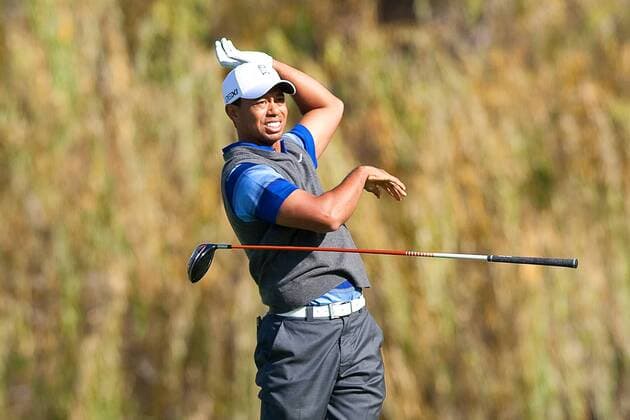 Dec. 2, 2011 - Thousand Oaks, California, U.S. - December 2, 2011: Tiger Woods looses his club on the 5th tee during the second round of the Chevron World Challenge held at Sherwood Country Club, Thousand Oaks, CA. 2011 Chevron World Challenge - ZUMAec2