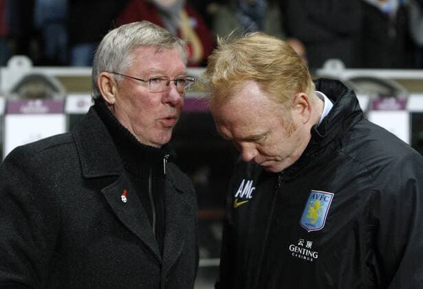 Football - Premier League - Aston Villa vs. Manchester United- Manchester United manager Alex Ferguson chats to Aston Villa Manager Alex McLeish before the game at Villa Park.