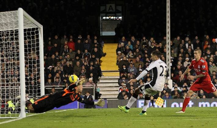 Fulhams Clint Dempsey scoring his sides opening goal Barclays Premier League Fulham v Liverpool 5th December, 2011 EDITORIAL USE ONLY. No use with unauthorised audio, video, data, fixture lists, club league logos or live services. Online in-match use limited to 120 images, no video emulation. No use in betting, games or single club league player publications.
