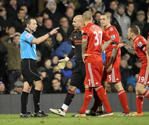 Liverpools players surround Kevin Friend after his sending off of Jay Spearing Barclays Premier League Fulham v Liverpool 5th December, 2011 EDITORIAL USE ONLY. No use with unauthorised audio, video, data, fixture lists, club league logos or live services. Online in-match use limited to 120 images, no video emulation. No use in betting, games or single club league player publications.