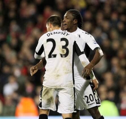 Fulhams Clint Dempsey celebrates scoring his sides opening goal with Dickson Etuhu Barclays Premier League Fulham v Liverpool 5th December, 2011 EDITORIAL USE ONLY. No use with unauthorised audio, video, data, fixture lists, club league logos or live services. Online in-match use limited to 120 images, no video emulation. No use in betting, games or single club league player publications.