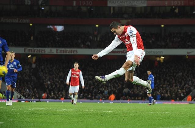 Football - Premier League - FC Arsenal vs. FC Everton Emirates stadium Robin Van Persie (FC Arsenal) scores his goal with a spectacular volley 