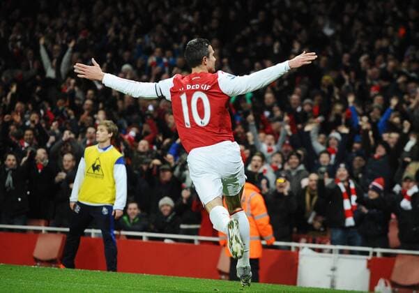 Football - Premier League - FC Arsenal vs. FC Everton Emirates stadium Robin Van Persie (FC Arsenal) celebrates his goal after a spectacular volley 