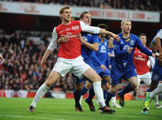 Football - Premier League - FC Arsenal vs. FC Everton Emirates stadium Phil Jagielka (FC Everton) tussels with Per Mertesacker(FC Arsenal) 