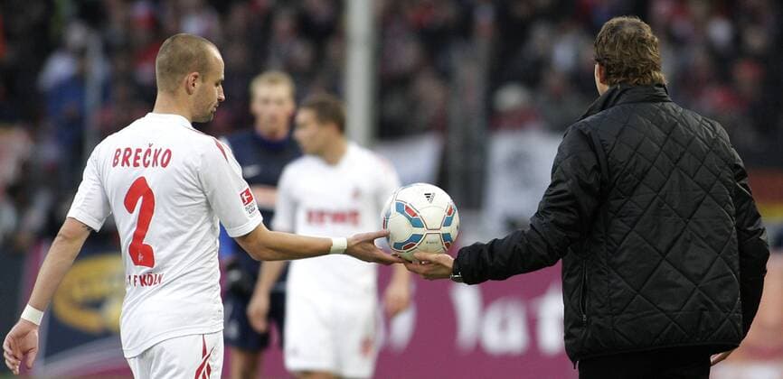Freiburg s head coach Marcus Sorg (R) gives Koeln s Miso Brecko the ball during the German First Division match between 1.FC Koeln and SC Freiburg, RheinEnergieStadion in Koeln on December 10., 2011. 1.FC Koeln gegen SC Freiburg am 16. Spieltag der Deutschen Bundesliga in der Saison 2011 2012 am 10. Dezember 2011.