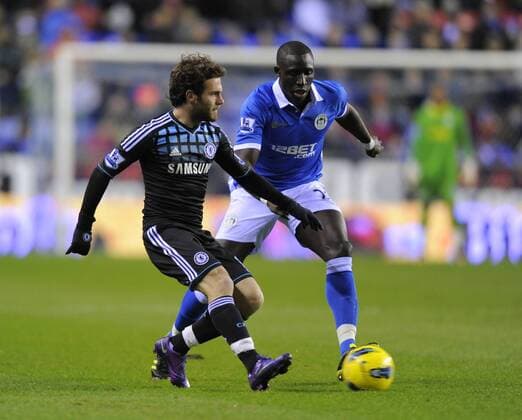 Juan Mata of Chelsea and Mohamed Diame of Wigan Athletic EDITORIAL USE ONLY. No use with unauthorised audio, video, data, fixture lists, club league logos or live services. Online in-match use limited to 120 images, no video emulation. No use in betting, games or single club league player publications.