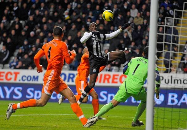 Demba Ba of Newcastle United (C) puts his shot wide of goal during the Premier League football match between Newcastle United and Swansea City on 17 December 2011, at Sports Direct Arena, Newcastle upon Tyne, England. EDITORIAL USE ONLY. No use with unauthorised audio, video, data, fixture lists, club league logos or live services. Online in-match use limited to 120 images, no video emulation. No use in betting, games or single club league player publications.