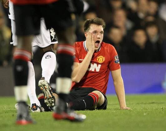 Manchester Uniteds Phil Jones goes off injured after getting caught in the face Barclays Premier League - Fulham FC vs. Manchester United - 21st December, 2011 EDITORIAL USE ONLY. No use with unauthorised audio, video, data, fixture lists, club league logos or live services. Online in-match use limited to 120 images, no video emulation. No use in betting, games or single club league player publications.
