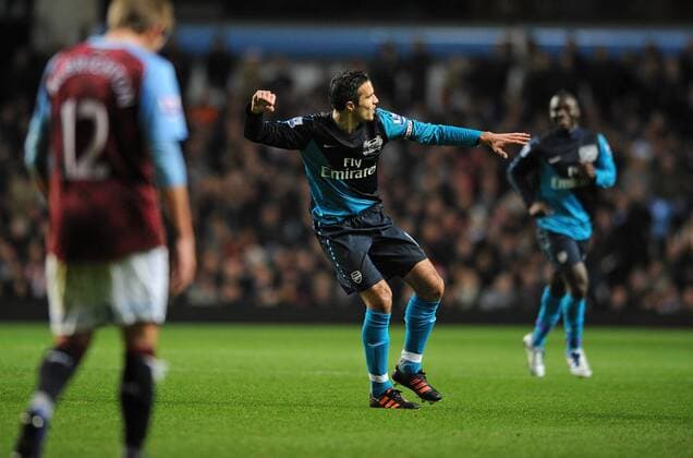 Football - Premier League - Aston Villa vs. Arsenal FC London Arsenal s Robin van Persie celebrates scoring their opening goal from the penalty spot at Villa Park, Birmingham 