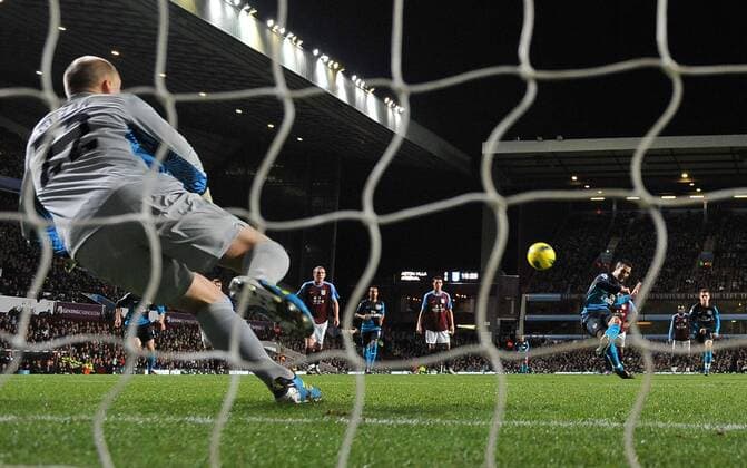 Football - Premier League - Aston Villa vs. Arsenal FC London Arsenal s Robin van Persie scores their opening goal from the penalty spot at Villa Park, Birmingham 