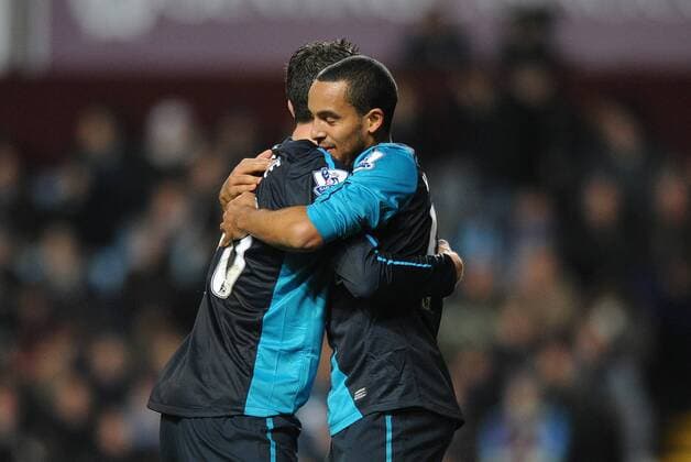 Football - Premier League - Aston Villa vs. Arsenal FC London Arsenal s Robin van Persie and Theo Walcott celebrate Yossi Benayoun s late winning goal at Villa Park, Birmingham 