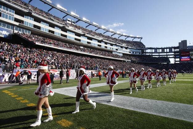 New England Patriots cheerleaders walk off the field before the game at Gillette Stadium in Foxboro, Massachusetts on December 24, 2011.  BOS2011122423