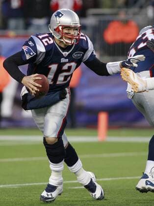 New England Patriots quarterback Tom Brady scrambles in the fourth quarter against the Miami Dolphins at Gillette Stadium in Foxboro, Massachusetts on December 24, 2011. The Patriots defeated the Dolphins 27-24.  BOS2011122420