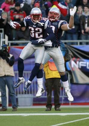 New England Patriots linebacker Devin McCourty (32) celebrates an interception with linebacker Rob Ninkovich (50) in the fourth quarter against the Miami Dolphins at Gillette Stadium in Foxboro, Massachusetts on December 24, 2011. The Patriots defeated the Dolphins 27-24.  BOS2011122412