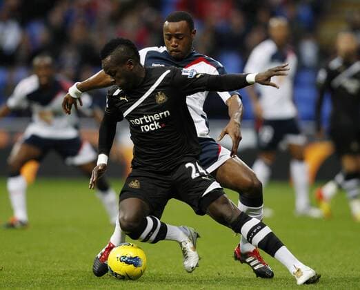 Bolton Wanderers - Newcastle United, Bolton s Nigel Reo-Coker and Newcastle s Cheik Tiote battle for the ball at The Reebok Stadium. 