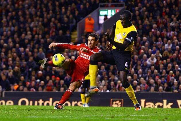 Liverpool FC - Blackburn Rovers, Maxi Rodriguez of Liverpool strikes the ball at Christopher Samba of Blackburn Rovers at Anfield 