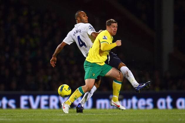 Football - Premier League - Norwich City vs. Tottenham Hotspur Tottenham s Younes Kaboul and Norwich s Grant Holt battle at Carrow Road 