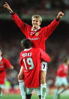 David Beckham (Man Utd) Celebrates victory with team mate Dwight Yorke. Manchester United 2:1 Bayern Munich, Champions League Cup Final, 26 05 1999. Barcelona. 