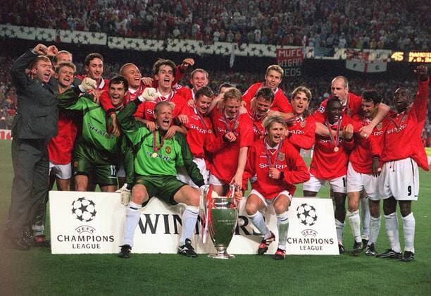 Peter Schmeichel and David Beckahm (front) with the trophy - Manchester United Champions League winners. Manchester United 2:1 Bayern Munich, Champions League Cup Final, 26 05 1999. Barcelona. 