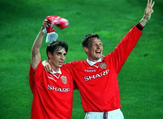 Gary Neville (Manchester) Celebrates With goal Scorer Teddy Sheringham as United celebrate the treble. Manchester United 2:1 Bayern Munich, Champions League Cup Final, 26 05 1999. Barcelona. 