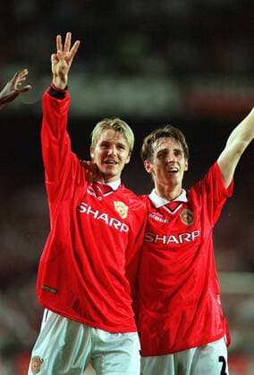 David Beckham (Man Utd) holds up 3 fingers after winning the treble with team mate Gary Neville. Manchester United 2:1 Bayern Munich, Champions League Cup Final, 26 05 1999. Barcelona. 