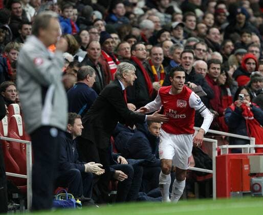 FC Arsenals Robin Van Persie celebrates scoring his sides opening goal with Arsene Wenger Barclays Premier League FC Arsenal v Queens Park Rangers at the Emirates, London 31st December, 2011 EDITORIAL USE ONLY. No use with unauthorised audio, video, data, fixture lists, club league logos or live services. Online in-match use limited to 120 images, no video emulation. No use in betting, games or single club league player publications.