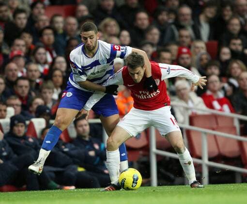 FC Arsenals Aaron Ramsay tussles with QPRs Adel Taarabt Barclays Premier League FC Arsenal v Queens Park Rangers at the Emirates, London 31st December, 2011 EDITORIAL USE ONLY. No use with unauthorised audio, video, data, fixture lists, club league logos or live services. Online in-match use limited to 120 images, no video emulation. No use in betting, games or single club league player publications.