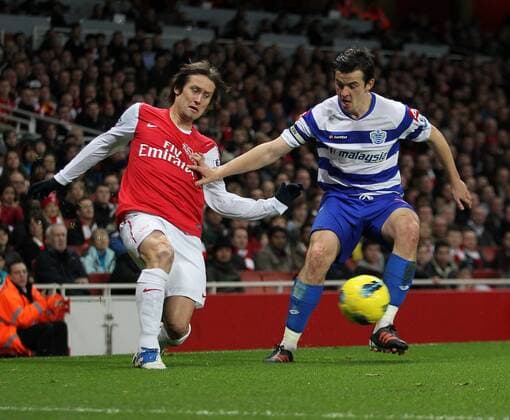 FC Arsenals Tomas Rosicky tussles with QPRs Joey Barton Barclays Premier League FC Arsenal v Queens Park Rangers at the Emirates, London 31st December, 2011 EDITORIAL USE ONLY. No use with unauthorised audio, video, data, fixture lists, club league logos or live services. Online in-match use limited to 120 images, no video emulation. No use in betting, games or single club league player publications.