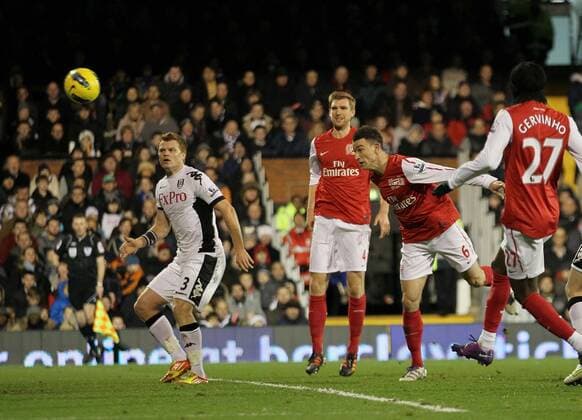Arsenals Laurent Koscielny scoring his sides opening goal Barclays Premier League Fulham v Arsenal at Craven Cottage, London 2nd January, 2012 EDITORIAL USE ONLY. No use with unauthorised audio, video, data, fixture lists, club league logos or live services. Online in-match use limited to 120 images, no video emulation. No use in betting, games or single club league player publications.