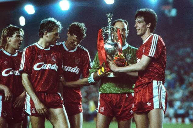 Gary Ablett (FC Liverpool) celebrate their League Championship title with the trophy. Bruce Grobbelaar - behind and Glenn Hysen and Barry Venison (left) FC Liverpool v Derby County 01 05 1990 