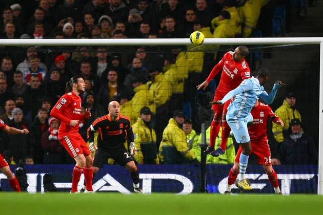 Football - Premier League - Manchester City vs. Liverpool Yaya Toure of Manchester City heads in his sides second goal at the Etihad Stadium 