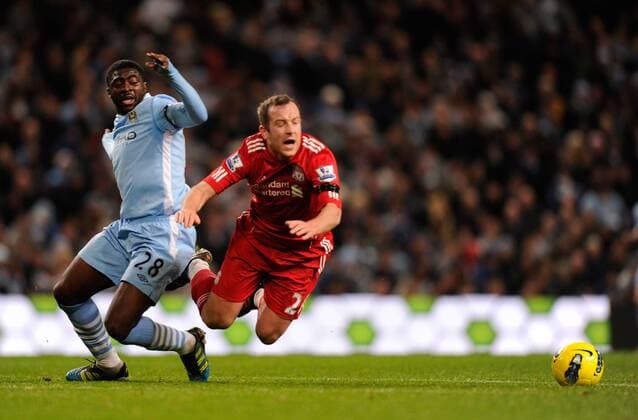 Kolo Toure of Manchester City brings down Charlie Adam of Liverpool for a free kick Barclays Premier League Manchester City v Liverpool at the Etihad Stadium, Manchester 3rd January, 2012 EDITORIAL USE ONLY. No use with unauthorised audio, video, data, fixture lists, club league logos or live services. Online in-match use limited to 120 images, no video emulation. No use in betting, games or single club league player publications.