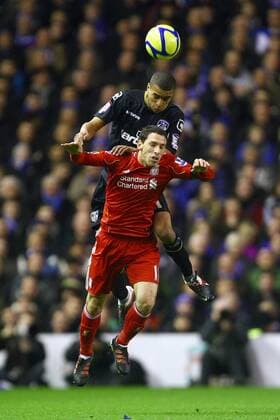 Football - FA Cup Third Round - Liverpool vs. Oldham Athletic Oldham s Tom Adeyemi wins a head over Maxi Rodriguez of Liverpool at Anfield 